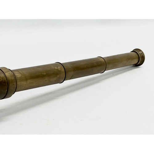 276A - A 19th Century brass telescope. Open 40cm.