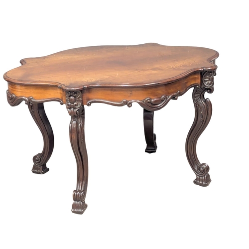 100A - A Mid 19th Century Victorian mahogany centre table on Cabriole legs and ornate frieze. Circa 1850-18... 