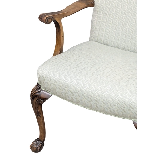 472 - A Early 20th Century George I style armchair on Cabriole legs and ball & claw feet.