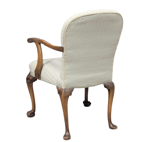 472 - A Early 20th Century George I style armchair on Cabriole legs and ball & claw feet.