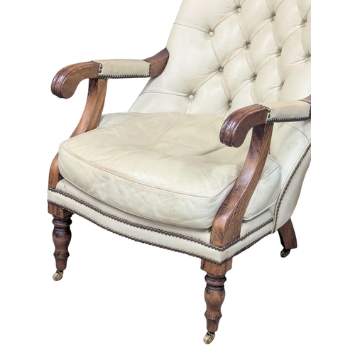 475 - A William IV style deep button back leather armchair.