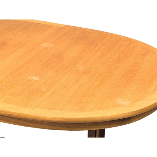 495 - A Mid Century teak extending dining table by Nathan. With leaf. 150x100x77cm