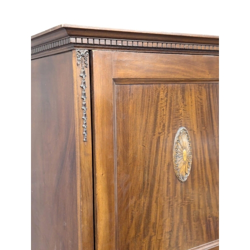 499 - A 1930s mahogany hall robe / cupboard. 70.5x52x196cm