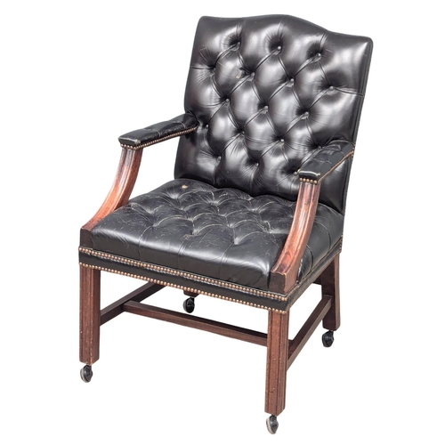 52 - A Gainsborough style deep button back leather armchair