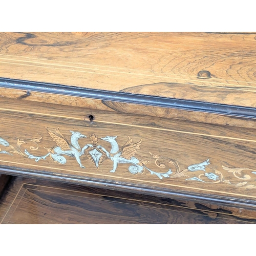 92 - A good quality Late 19th Century inlaid rosewood writing desk on square tapering legs. Inlaid with b... 