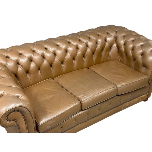 237 - A leather deep button back 3 seater sofa. 202cm