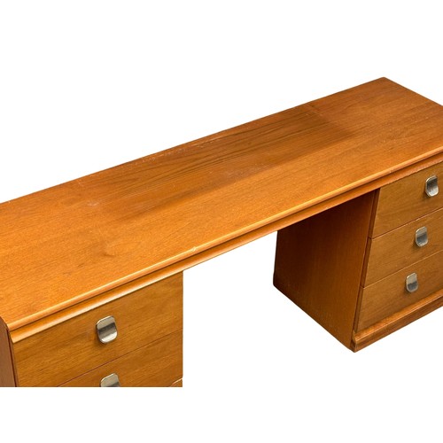 262A - A Mid Century teak dressing table. Meredew Avalon. 148x43x67cm