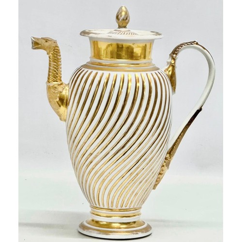 9 - Paris Porcelain. A large Early 19th Century French Empire gilt coffee pot. Circa 1810-1830. 23x28cm.... 