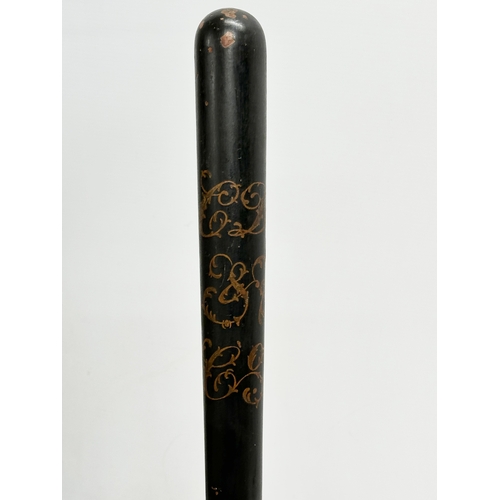 513A - A 19th Century Victorian ebonised truncheon with turned handle. 43cm