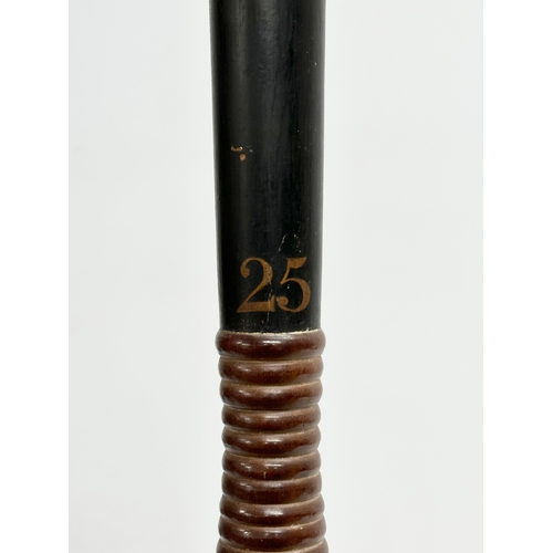 513A - A 19th Century Victorian ebonised truncheon with turned handle. 43cm