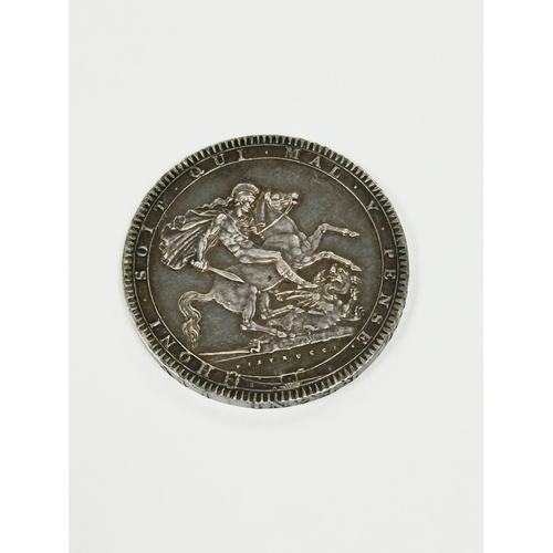 585A - A George III silver crown. Dated 1819.  (2)