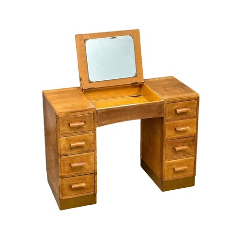 331 - An Art Deco oak dressing table. Heals style. Circa 1940. 107x47x77cm