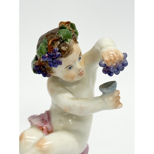 25 - A Meissen Putti with Grapes figurine. 8.5cm.