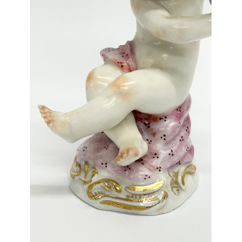 25 - A Meissen Putti with Grapes figurine. 8.5cm.