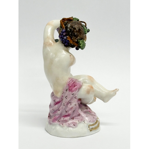 25 - A Meissen Putti with Grapes figurine. 8.5cm.