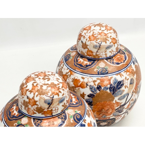 206 - A pair of 20th Century Chinese Imari ginger jars. 17x21cm.