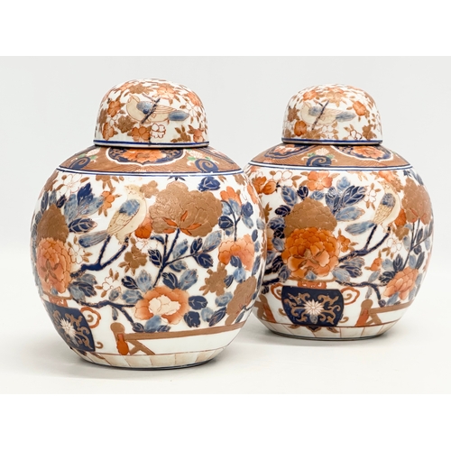 206 - A pair of 20th Century Chinese Imari ginger jars. 17x21cm.