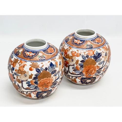 206 - A pair of 20th Century Chinese Imari ginger jars. 17x21cm.