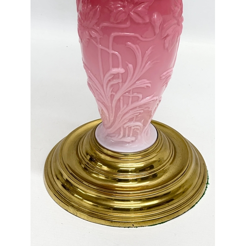 119 - A large Late 19th Century Victorian double burner, opaline glass oil lamp. With diamond shade, embos... 