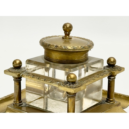 181 - A Late 19th Century Victorian brass inkstand with cut glass inkwell. 12x12x10cm.