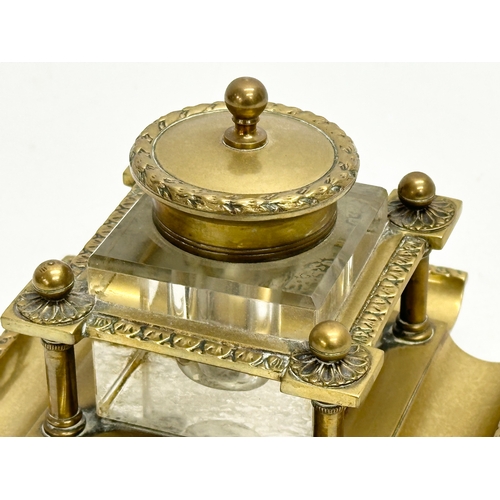 181 - A Late 19th Century Victorian brass inkstand with cut glass inkwell. 12x12x10cm.