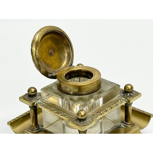 181 - A Late 19th Century Victorian brass inkstand with cut glass inkwell. 12x12x10cm.