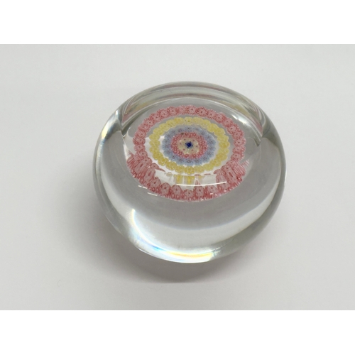 102 - A Baccarat millefiori glass paperweight. 6.5x5cm