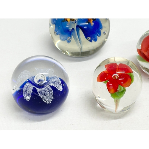 110 - 4 art glass paperweights.