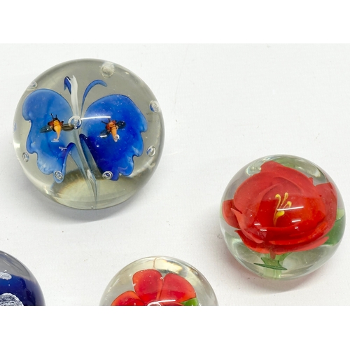 110 - 4 art glass paperweights.