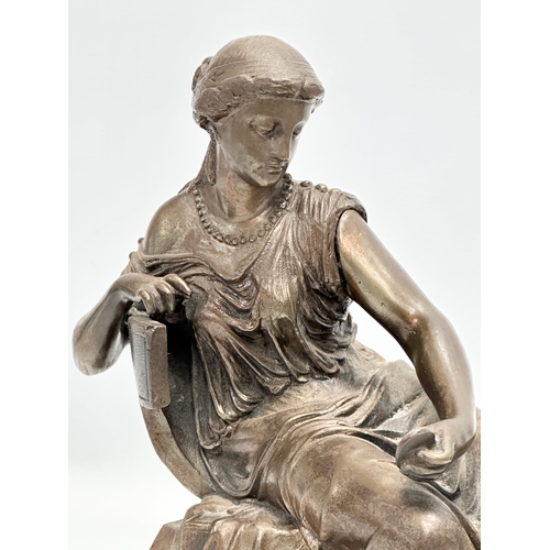 127 - A large 19th Century cast iron sculpture of a Neoclassical seated lady. 30x27cm.