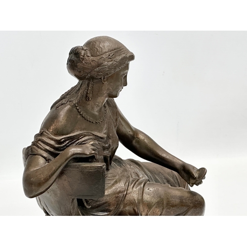 127 - A large 19th Century cast iron sculpture of a Neoclassical seated lady. 30x27cm.