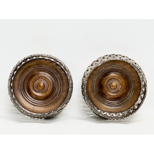 182 - A pair of large Early 20th Century silver plated crown form bottle coasters. 15x8cm