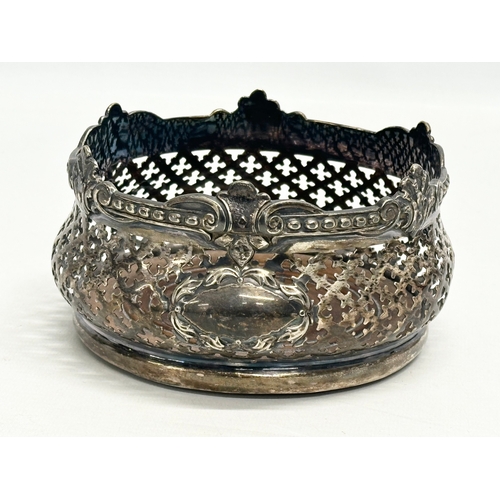 182 - A pair of large Early 20th Century silver plated crown form bottle coasters. 15x8cm