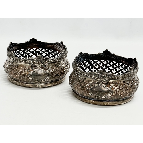 182 - A pair of large Early 20th Century silver plated crown form bottle coasters. 15x8cm