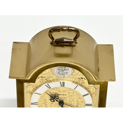 531 - A Tempus Fugit Swiza mantle clock with brass foliage face and frame. 11x6x16cm