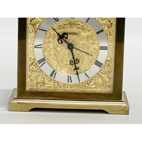 531 - A Tempus Fugit Swiza mantle clock with brass foliage face and frame. 11x6x16cm