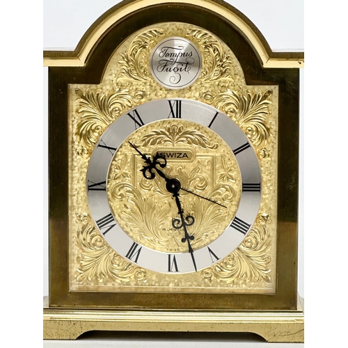 531 - A Tempus Fugit Swiza mantle clock with brass foliage face and frame. 11x6x16cm