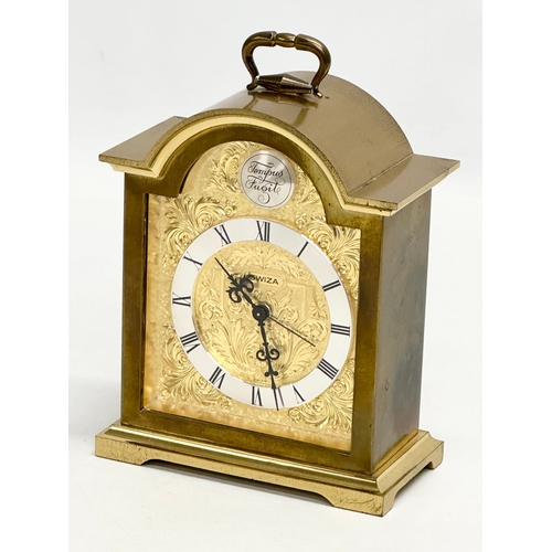 531 - A Tempus Fugit Swiza mantle clock with brass foliage face and frame. 11x6x16cm