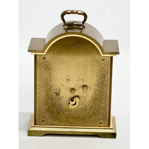 531 - A Tempus Fugit Swiza mantle clock with brass foliage face and frame. 11x6x16cm