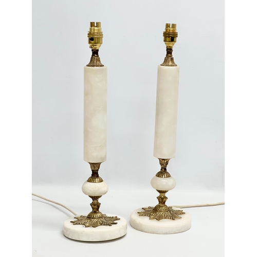 511 - A pair of tall Mid 20th Century brass and marble table lamps. 67cm with shades.