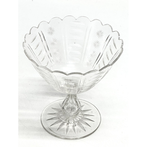 164 - A Late 19th Century star and slice cut compote/candy dish with hollow glass column. 14x14cm.