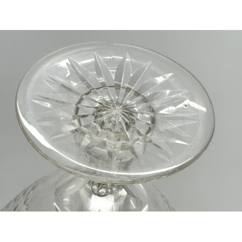 164 - A Late 19th Century star and slice cut compote/candy dish with hollow glass column. 14x14cm.