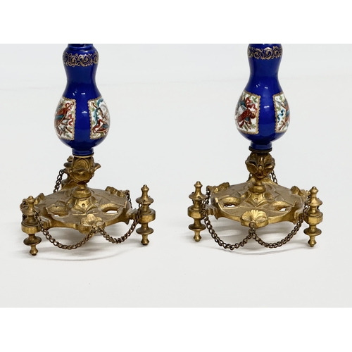 86 - A pair of Late 19th Century French gilt brass candlesticks with covers and hand painted cobalt blue ... 