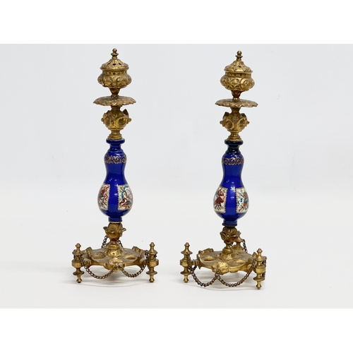 86 - A pair of Late 19th Century French gilt brass candlesticks with covers and hand painted cobalt blue ... 