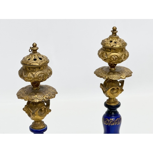 86 - A pair of Late 19th Century French gilt brass candlesticks with covers and hand painted cobalt blue ... 