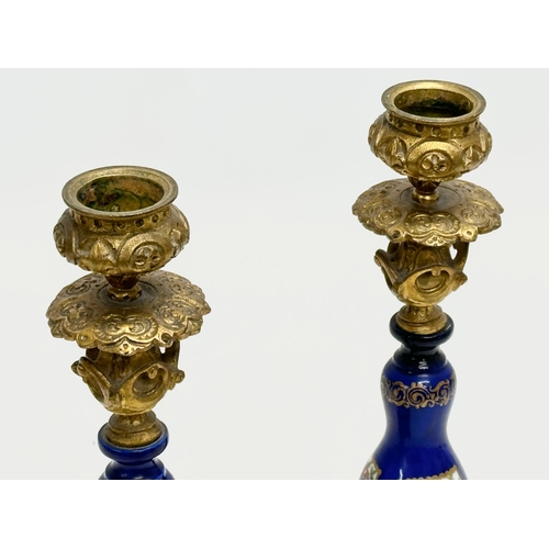 86 - A pair of Late 19th Century French gilt brass candlesticks with covers and hand painted cobalt blue ... 