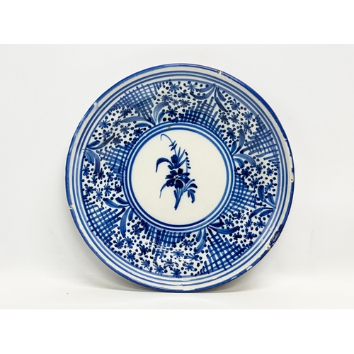 188 - Two 19th Century Italian and Dutch delft plates. 31cm. 27cm.