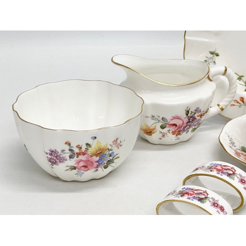 526 - A quantity of Royal Crown Derby “Posies” . Including tea cup, saucers and sandwich plate, 4 napkin r... 