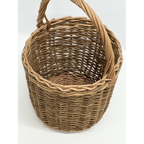 537 - A good quality vintage wicker basket. 31x29x46cm.