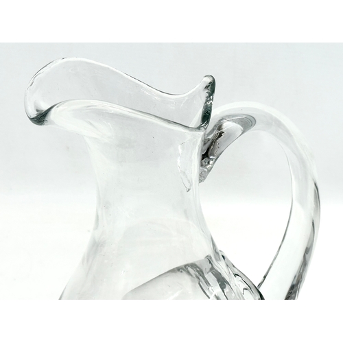 231 - An Early 20th Century French glass water jug with ice chamber. 19x27cm